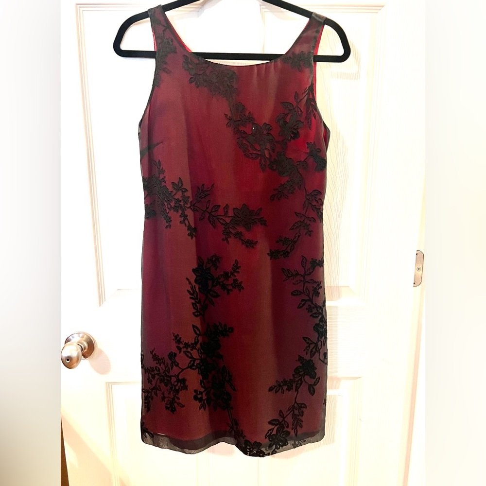 Red sleeveless dress with sheer black lace overlay